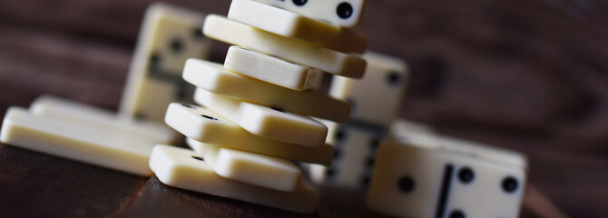 Poster - white dominoes on a wooden table