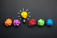 Great Idea Concept With Crumpled Colorful Paper And Light Bulb On Black Background