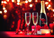 © Subbotina Anna - Valentine's Day romantic dinner. Champagne, candles and gift box over holiday red background. Wedding celebrating. Birthday party