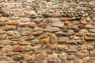 Wall Mural - Medieval Stone Wall Texture. Old brick and stone wall with thick grout and very rough, irregular surface.