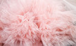  draped background of pink powdery fabric in the form of tulle, texture