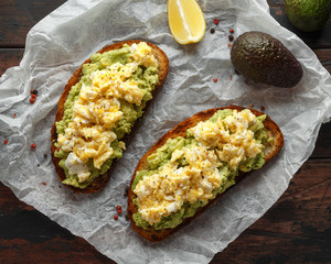 Wall Mural - Vegetarian Avocado and scrambled egg sourdough toast.