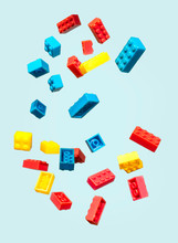 Floating Plastic Geometric Cubes In The Air. Construction Toys On Geometric Shapes Falling Down In Motion.