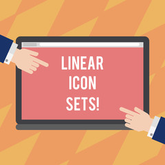 Fototapete - Text sign showing Linear Icon Sets. Conceptual photo figures help us to go faster in way or open phone app Hu analysis Hands from Both Sides Pointing on a Blank Color Tablet Screen