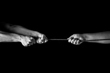 Tug War, Man Vs Woman Pulling Rope In Opposite Directions Unequally, Uneven. Copy Space