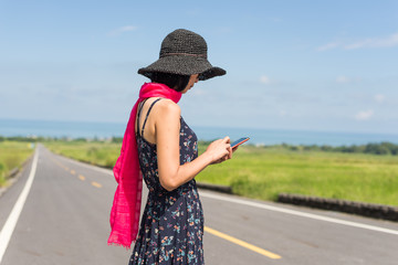 Poster - woman walk and use a cellphone