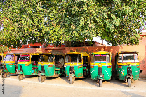 Tuk-tuks parked in Taj Ganj neighborhood of Agra, Uttar Pradesh, India Poster Mural XXL