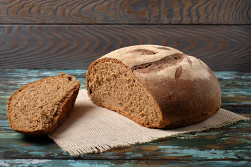 freshly baked sliced bread on rustic wooden table