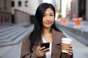 Canvas Print - Young Asian woman in city