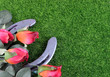 Red silk roses, a horseshoe and artificial green grass for the running of the thoroughbred race called the Kentucky Derby. Copy space