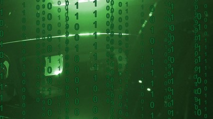Flashing lights from an emergency vehicle with binary computer code scrolling over the screen