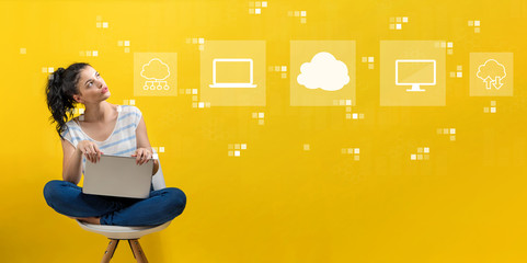 Cloud computing with young woman using a laptop computer 