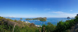 Fototapeta  - Panoramic blue sky background with white clouds on a sunny day over the sea in flores island, Labuan bajo, Indonesia