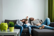 © Aliaksandr Marko - The family is resting on the couch all together. Concept of spending time together, happy family.