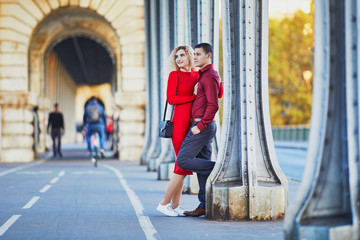 Wall Mural - Romantic couple walking on Bir-Hakeim bridge in Paris, France