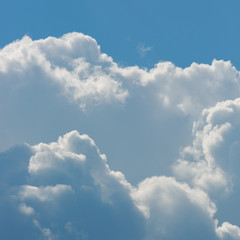 fluffy white cloud above clear blue sky background