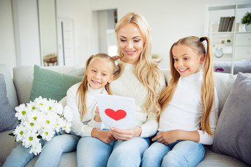 Poster - Portrait of nice lovely pretty charming attractive stylish mom pre-teen girls sitting on divan looking giving receiving gifts daydream congrats greetings in light white room