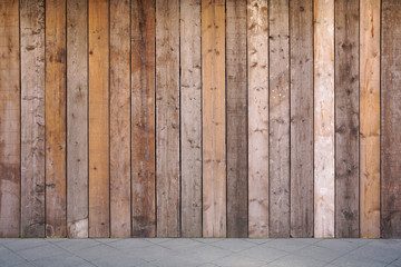 Wall Mural - sidewalk and boarded up wall with weathered wooden planks as background                               