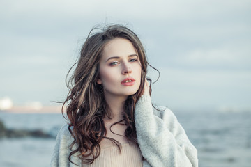 Beautiful woman outdoors portrait. Nice girl relaxing outdoor