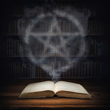 The Old Mysterious Book And The Smoke Coming Out Of It Is A Sign Of The Pentagram. Occult, Esoteric, Divination, Magic Concept Background.