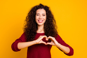 Close up photo beautiful amazing her she lady arm friendly show healthy heart shape figure form wearing red knitted sweater clothes outfit isolated yellow bright background