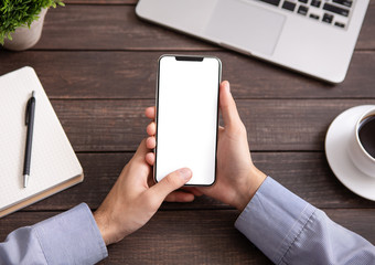 Poster - Man using blank smartphone on workplace desk