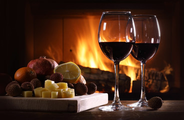 Still life of a glasses of wine and fruit with cheese