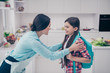 © deagreez - Portrait of two nice-looking cute lovely sweet charming attractive cheerful people mature mommy preparing pre-teen girl to college in light white kitchen interior indoors