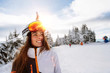 © marko - Close up Happy girl enjoying winter moments helmet on his head