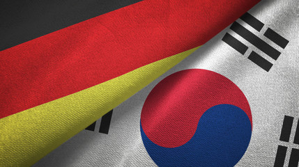 Germany and South Korea two flags textile cloth, fabric texture