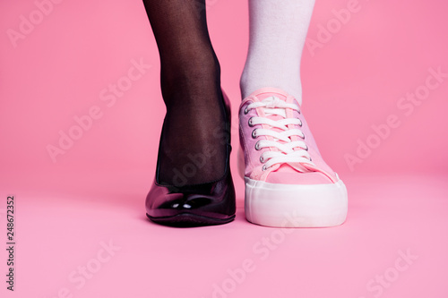 Cropped close-up view image concept photo of two different fit thin slim legs co Tableau sur Toile