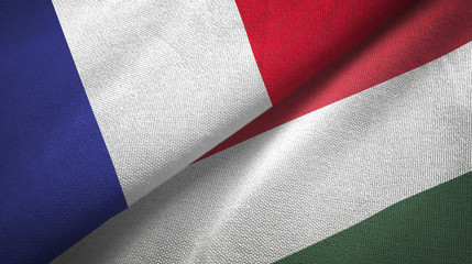 Wall Mural - France and Hungary two flags textile cloth, fabric texture