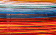 © wlad074 - Colored threads of an ancient wooden loom
