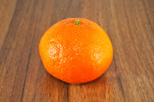 Beautiful Juicy Tangerine On Wooden Table Close Up