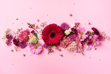 Spring Composition Of Pink Flowers On Punchy Pastel Background With Copy Space. Creative Layout. Flat Lay. Top View. Summer Minimal Concept.
