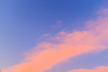Wall Mural - Beautiful red, orange and yellow clouds and blue sky background. Colorful exotic sky with orange clouds and blue sky on background