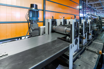 Wall Mural - Roller forming machine. The interior of the plant producing a metal profile.