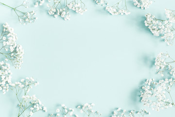 Wall Mural - Flowers composition. Gypsophila flowers on pastel blue background. Flat lay, top view, copy space