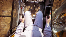 The Driver View, Control Panel Of A Modern Bulldozer Or Excavator Or Loader, A Man In Heavy Equipment Machinery Tractor Construction Duty Vehicle Command Cabin.