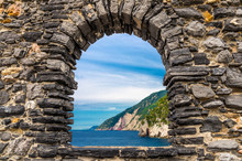 Grotta Di Lord Byron With Blue Water And Coast With Rock Cliff Through Stone Wall Window, Portovenere Town, Ligurian Sea, Riviera Di Levante, National Park Cinque Terre, La Spezia, Liguria, Italy