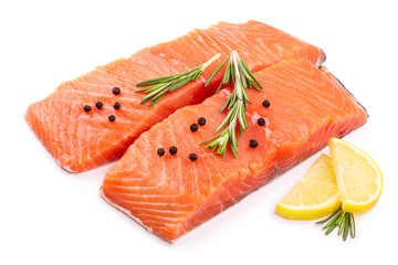 Wall Mural - fillet of red fish salmon with lemon and rosemary isolated on white background