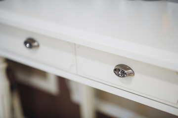 Two wooden drawers with rustic metal handles - detail.handle lockers