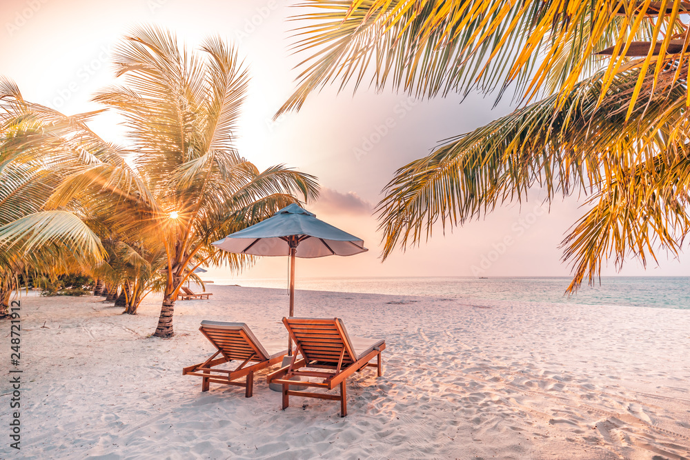 Beautiful beach. Chairs on the sandy beach near the sea. Summer holiday and vacation concept for tourism. Inspirational tropical landscape  - obrazy, fototapety, plakaty 