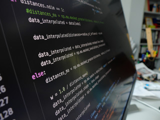 closeup of the python code on the monitor