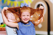 © Evgeniy Kalinovskiy - active beautiful funny baby girl with red hair smiling and grimacing