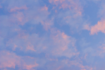 Wall Mural - Colorful with red, orange and blue dramatic sky on the clouds for abstract background. Romantic sunset background with beautiful blue, red and yellow clouds.