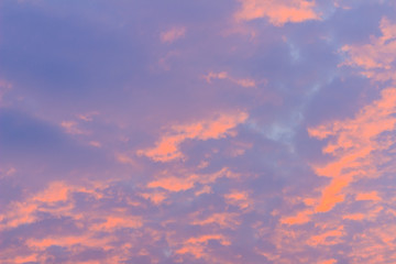 Wall Mural - Colorful with red, orange and blue dramatic sky on the clouds for abstract background. Romantic sunset background with beautiful blue, red and yellow clouds.