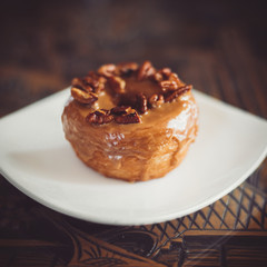 Wall Mural - Walnut Maple Cronut on a white plate