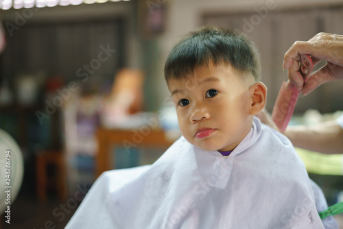 Asian Boy Getting Hair Cut By Barber Buy This Stock Photo And