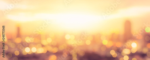 Cuadros en Lienzo Summer sun blur golden hour hot sunset sky with city rooftop view background cit